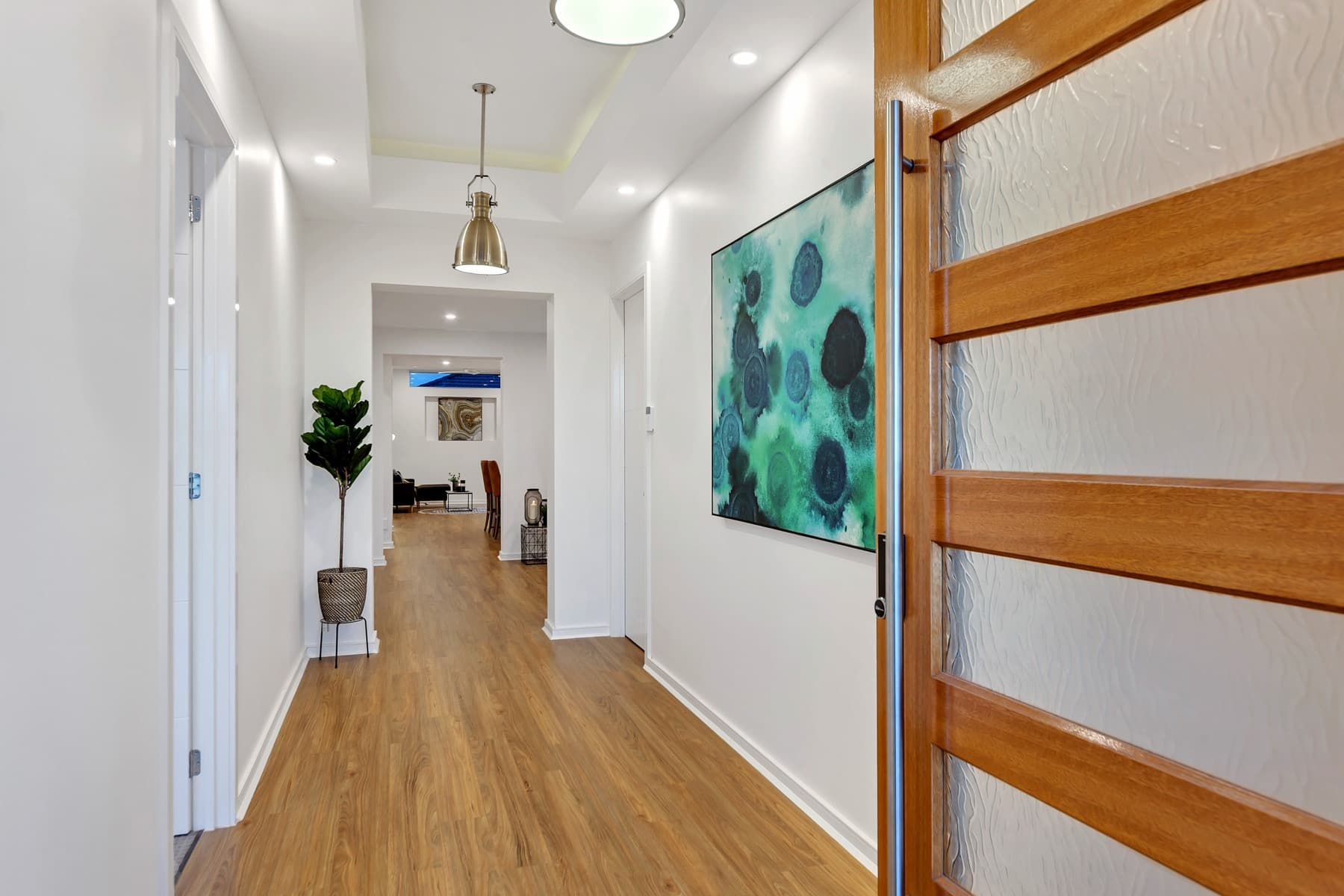 The hallway toward the timber front door