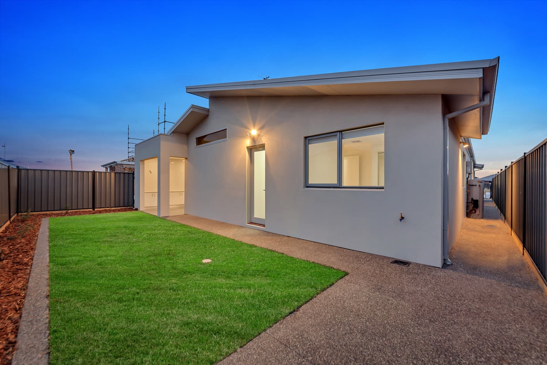 The rear elevation of the home at dusk