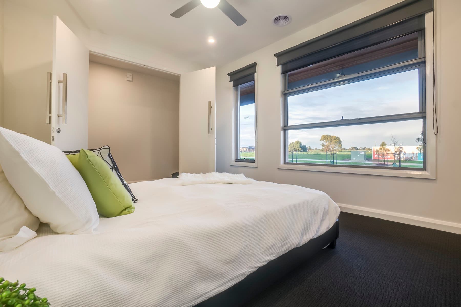 A bedroom and the outlook past its window