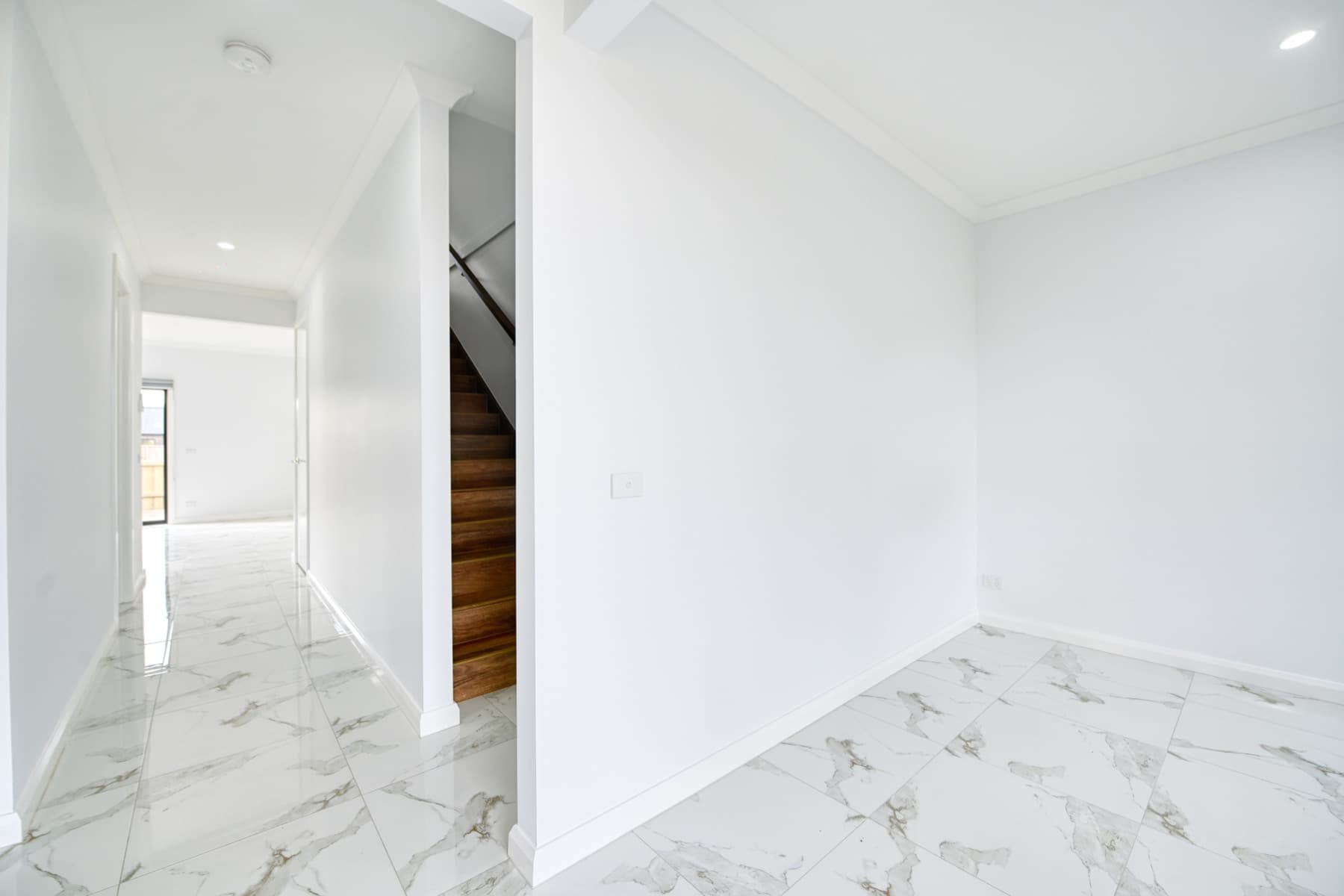 The hallway leading to the staircase