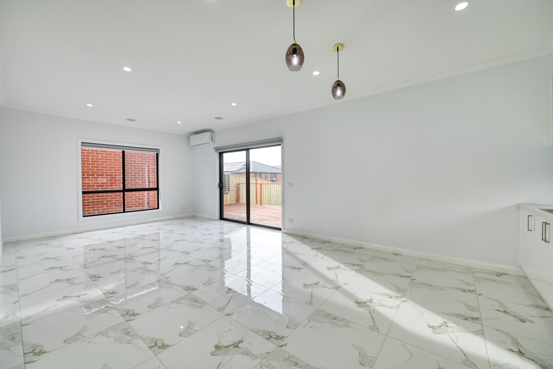 The living room with marble look tiles underfoot