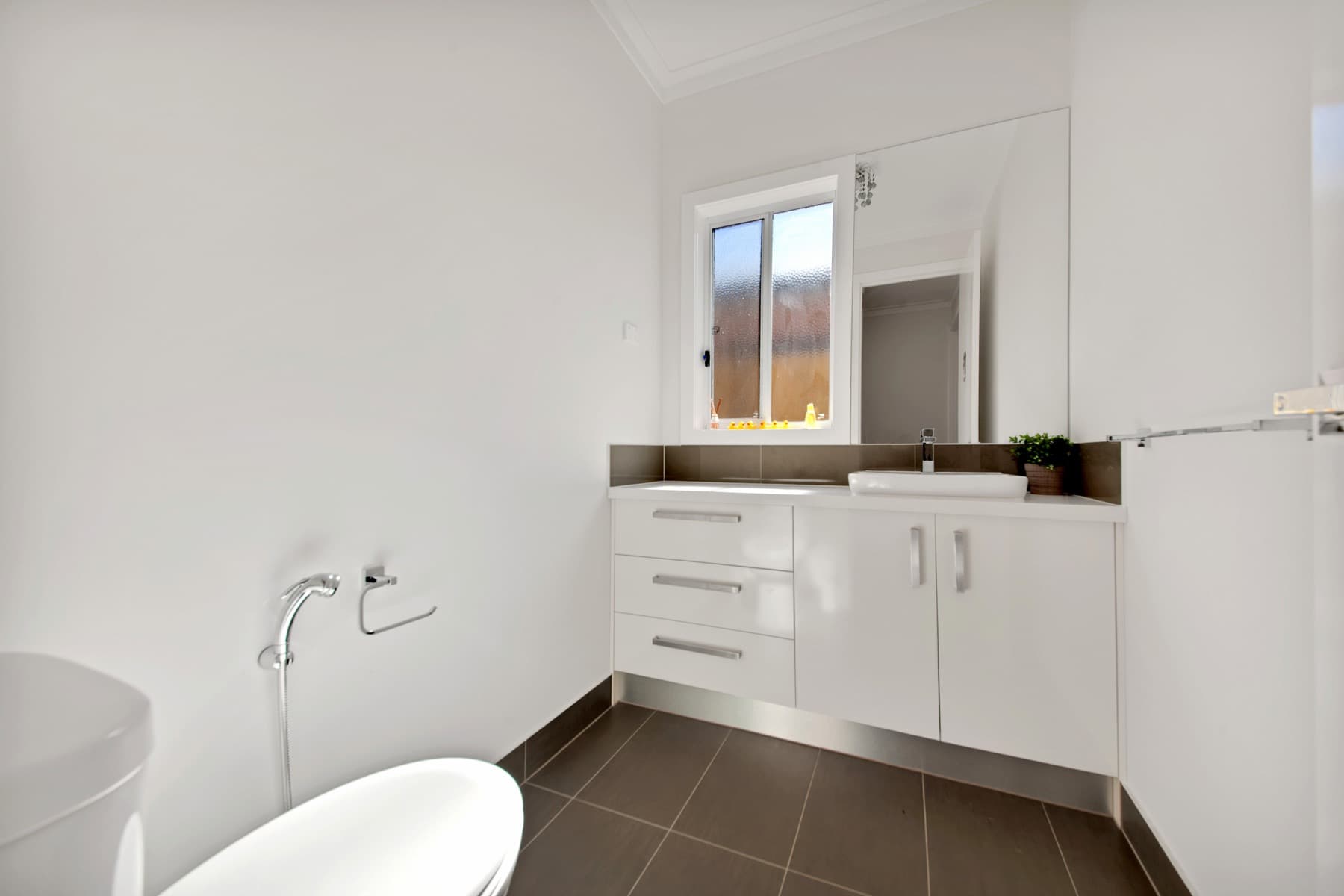 The bathroom vanity and bath