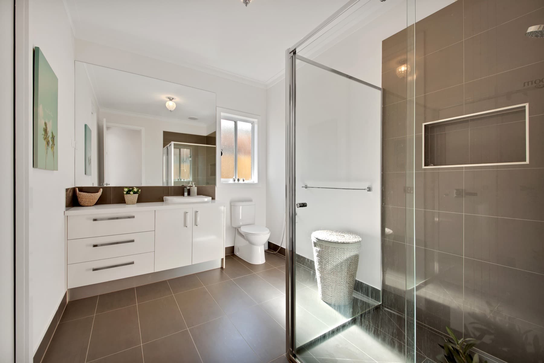 The dark tiled ensuite