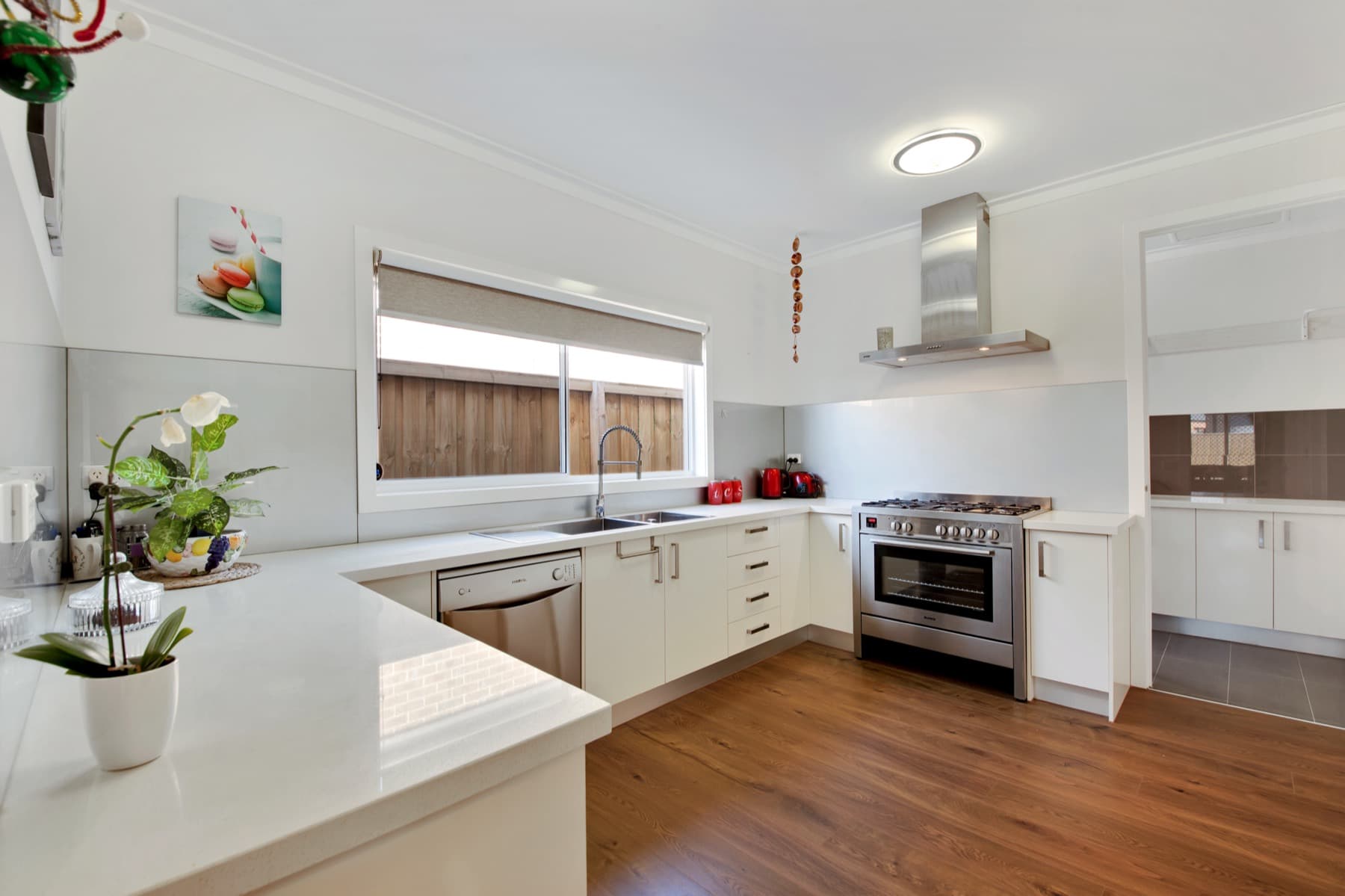 The white kitchen and its stainless range