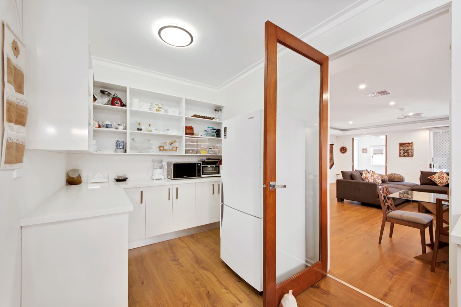 The walk through pantry beside a timber door