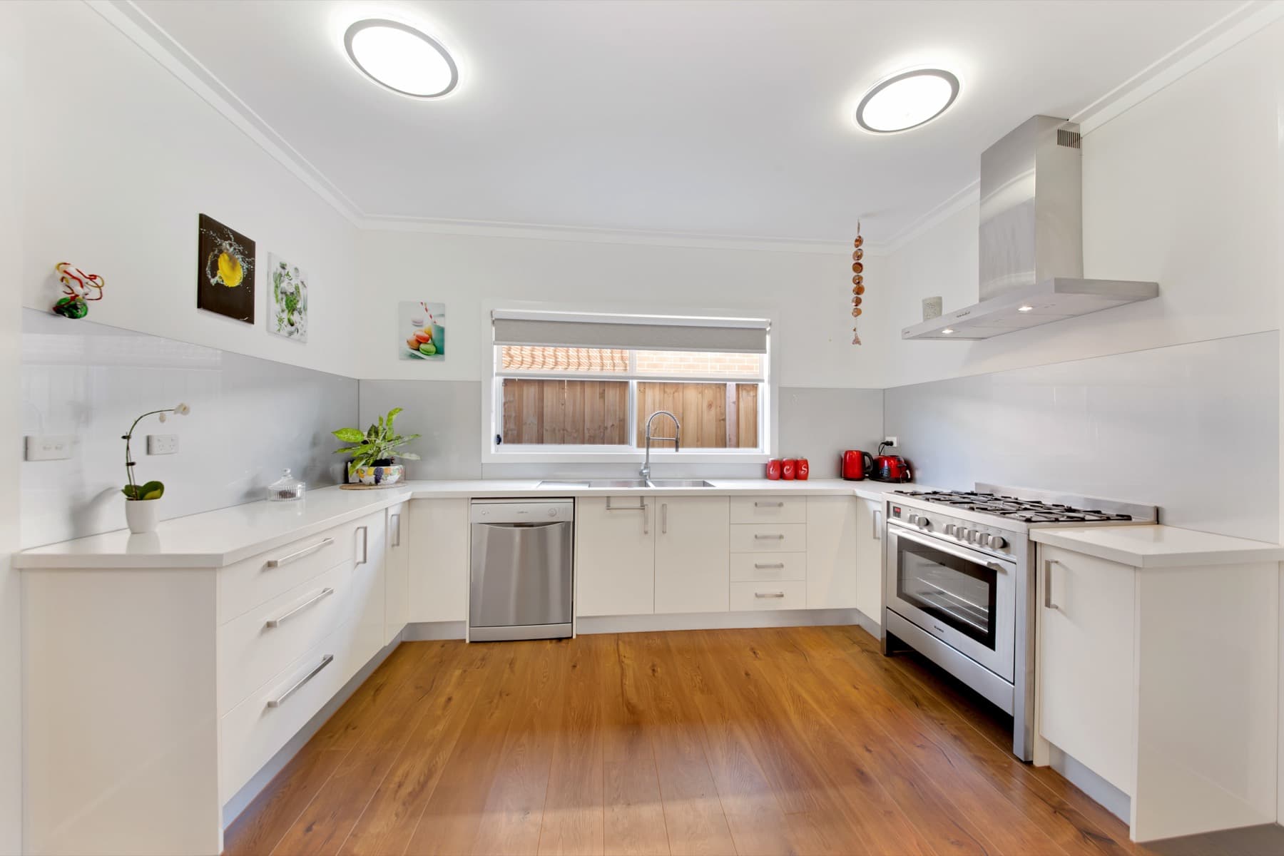 The kitchen benches over a timber floor