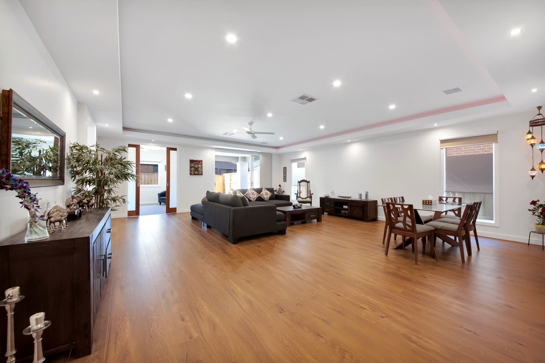 The open plan living and dining area of the completed home