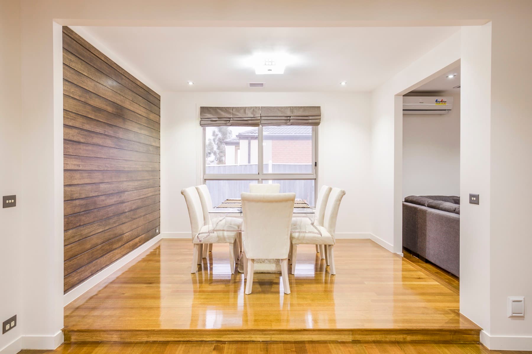 The dining room against a timber feature wall
