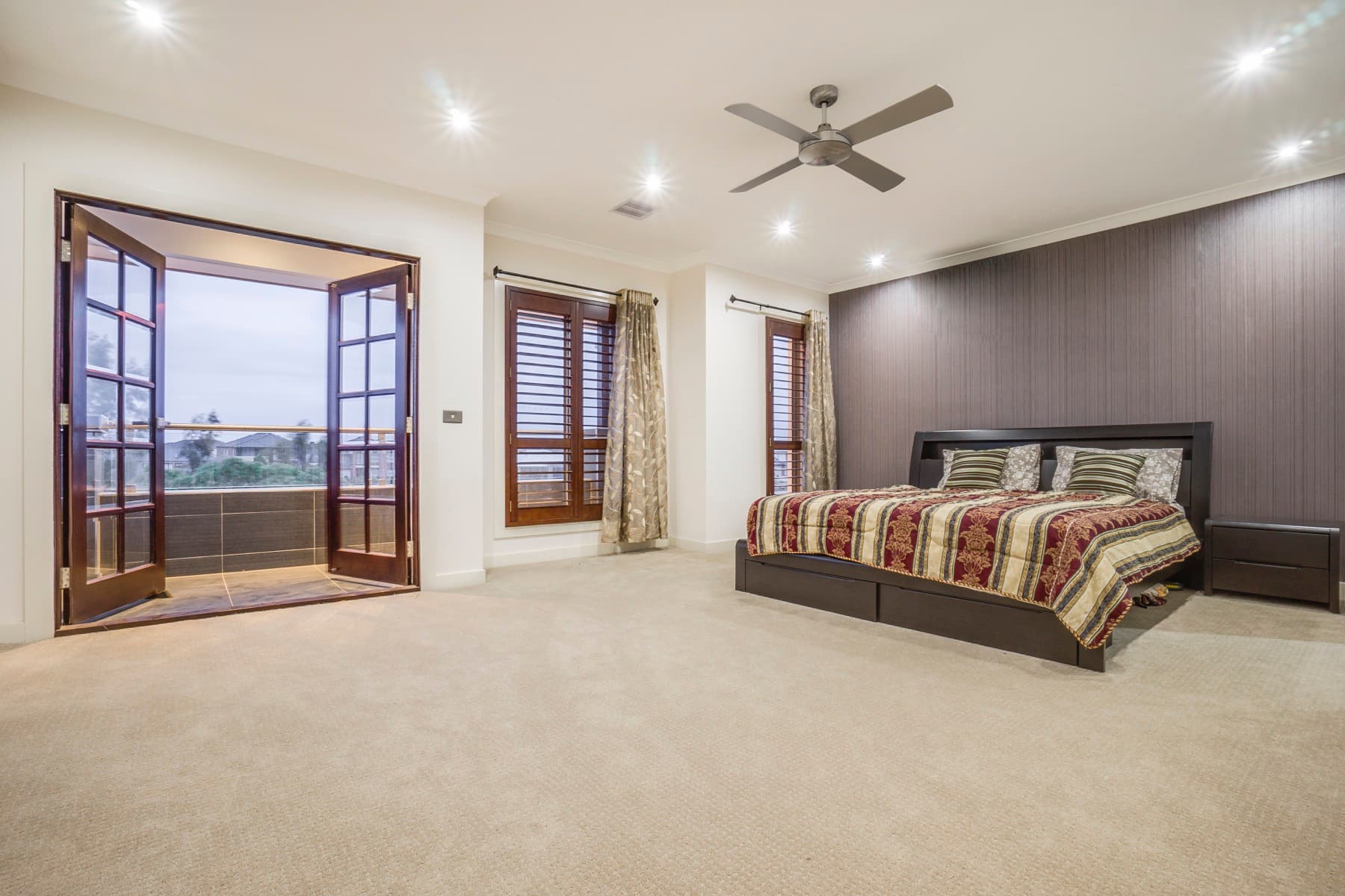The main bedroom and its french doors