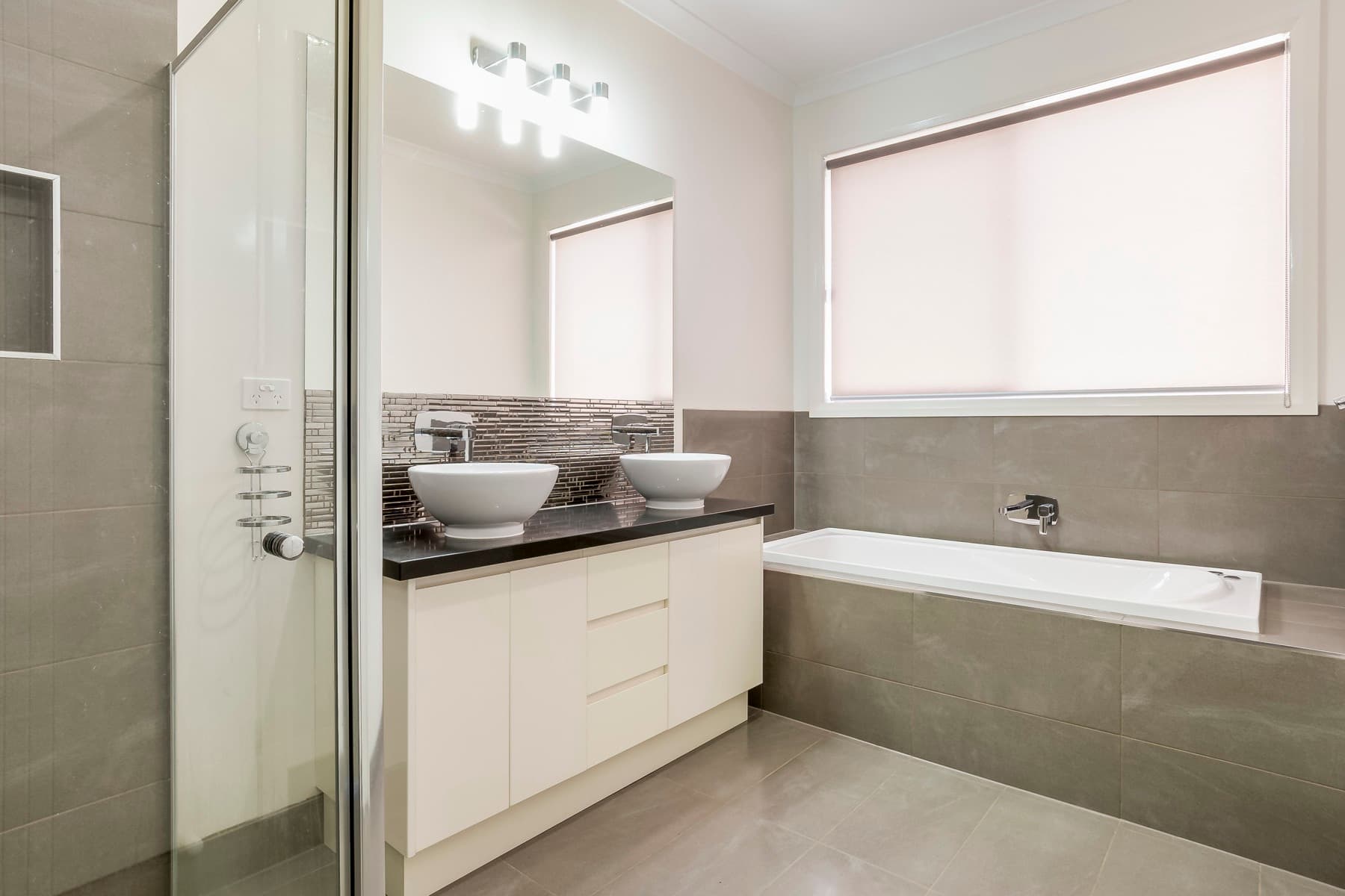 The bathroom vanity and bath